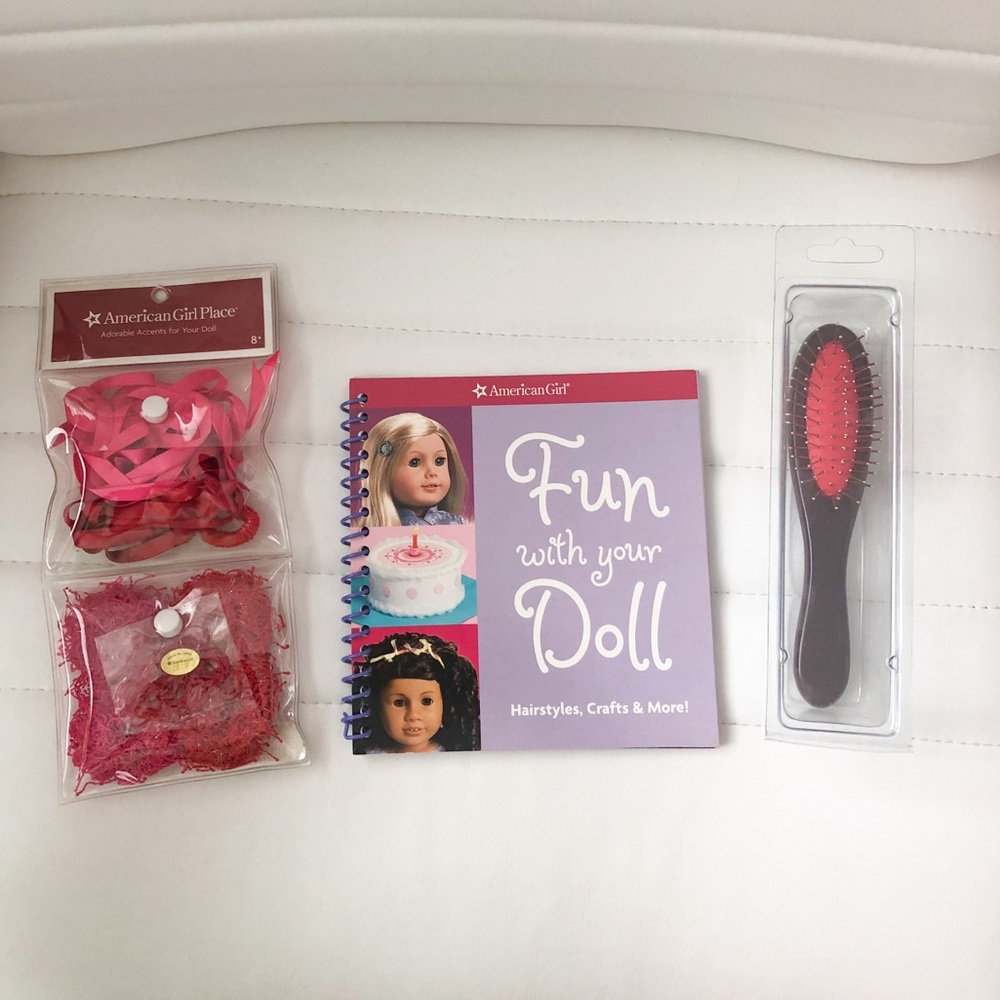 American Girl hairbrush, book, & hair accessories